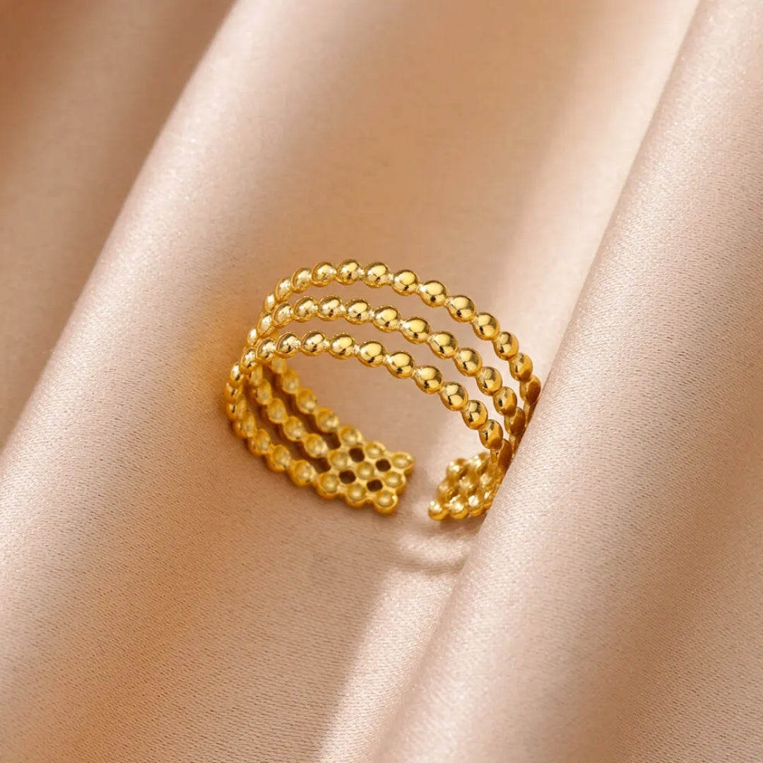 Verstellbarer Ring mit mehreren Reihen goldener Perlen