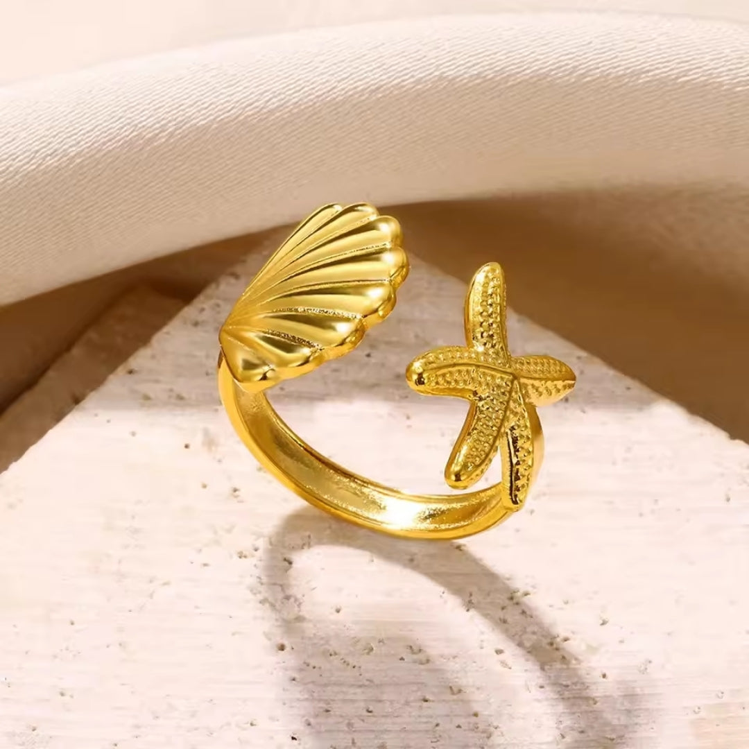 Anello dorato regolabile con motivo oceanico