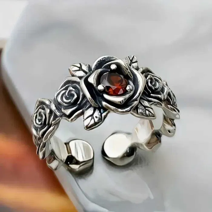 Anello con fiore argentato e cristallo arancione regolabile