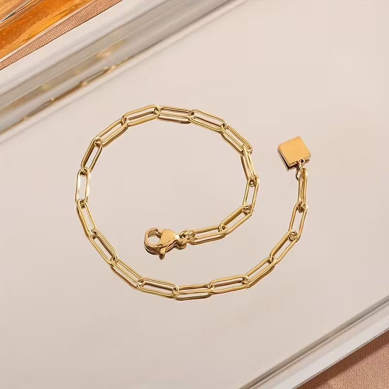 Bracciale regolabile dorato con maglie a graffetta