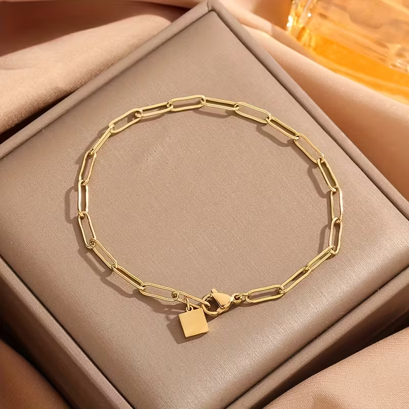 Bracciale regolabile dorato con maglie a graffetta